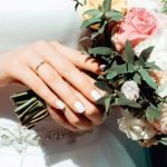 woman-holding-white-and-pink