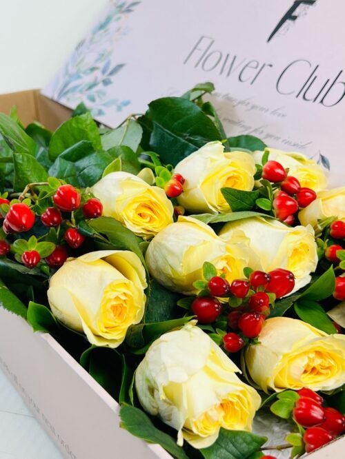 fresh white roses arrangement in a box