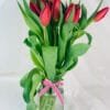 bunch of red tulips in a vase